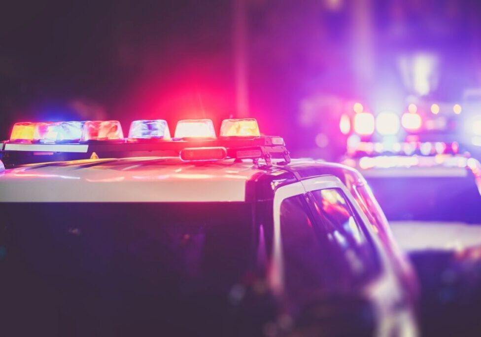 Image of multiple police cars with their roof lights on