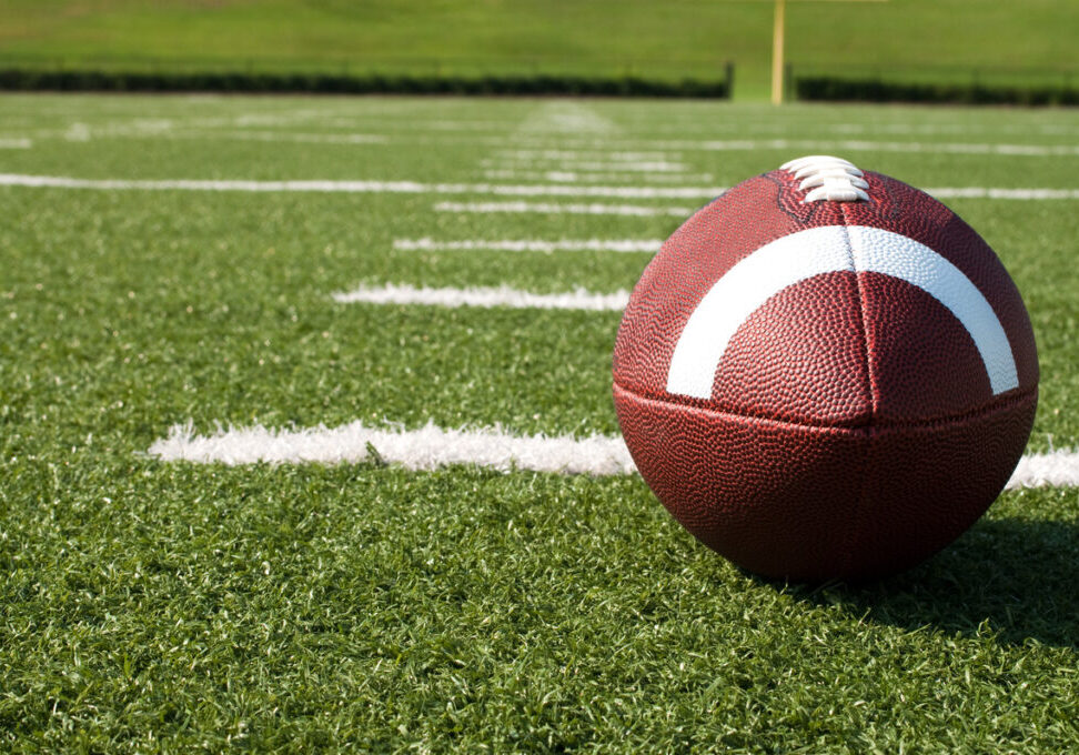 Football Image of a football sitting on a football field