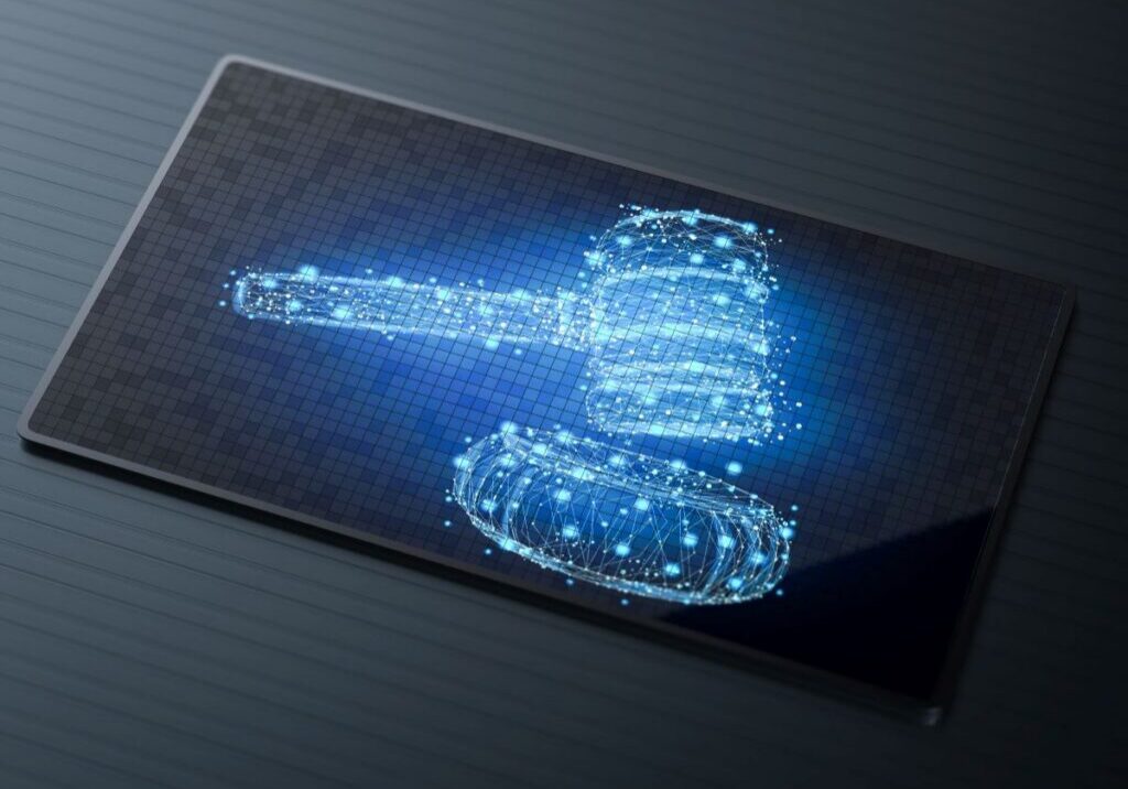 July_AI_use Digital image of a gavel on a tablet