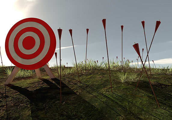 Computer generated archery target with computer generated arrows stuck in the ground surrounding it