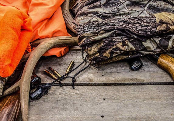 penney-assoc-hunting-gear Hunting gear laying on wooden deck