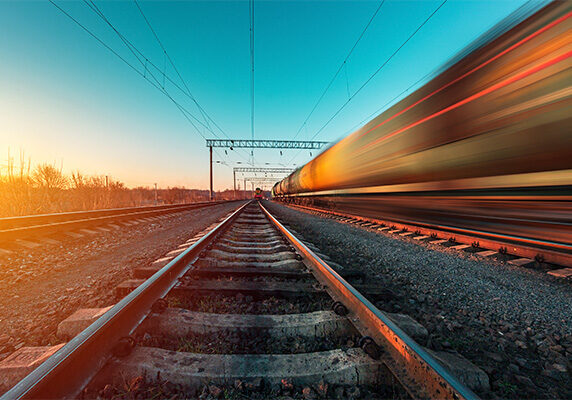 Long exposure image of a train passing an empty set of tracks